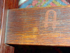 Red decal signature on rocking chair.